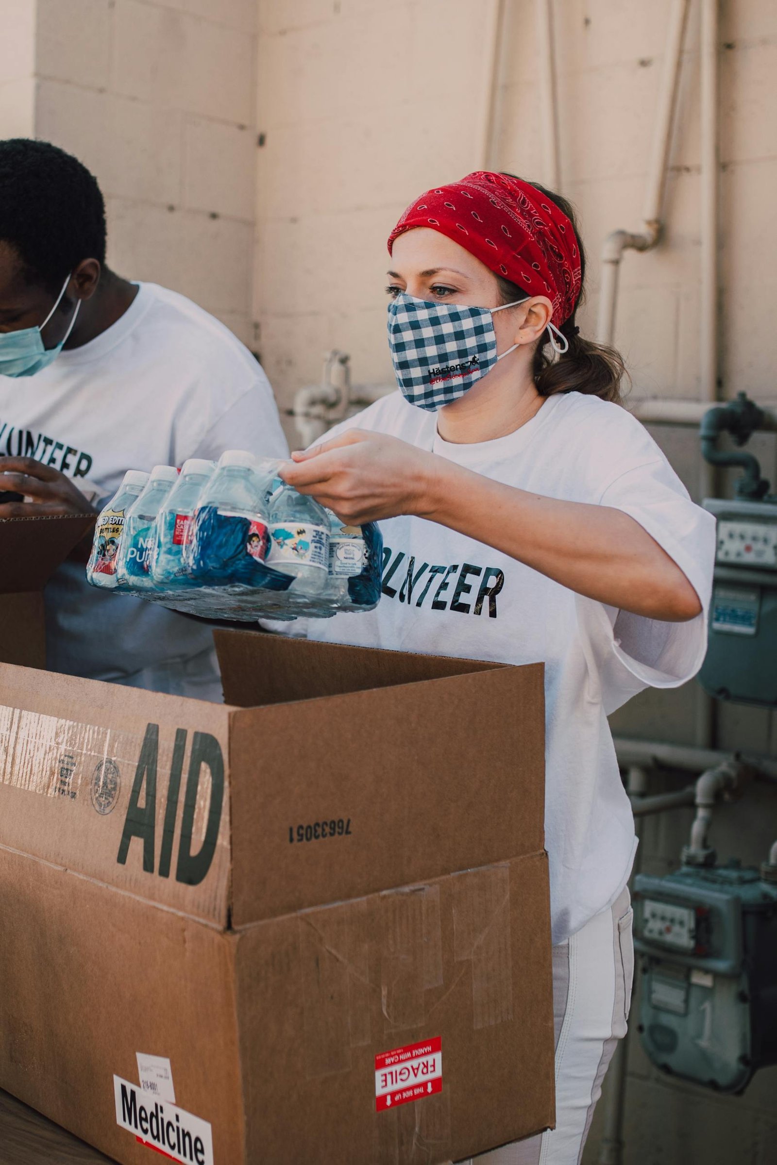 A Woman Unboxing a Bottled Water